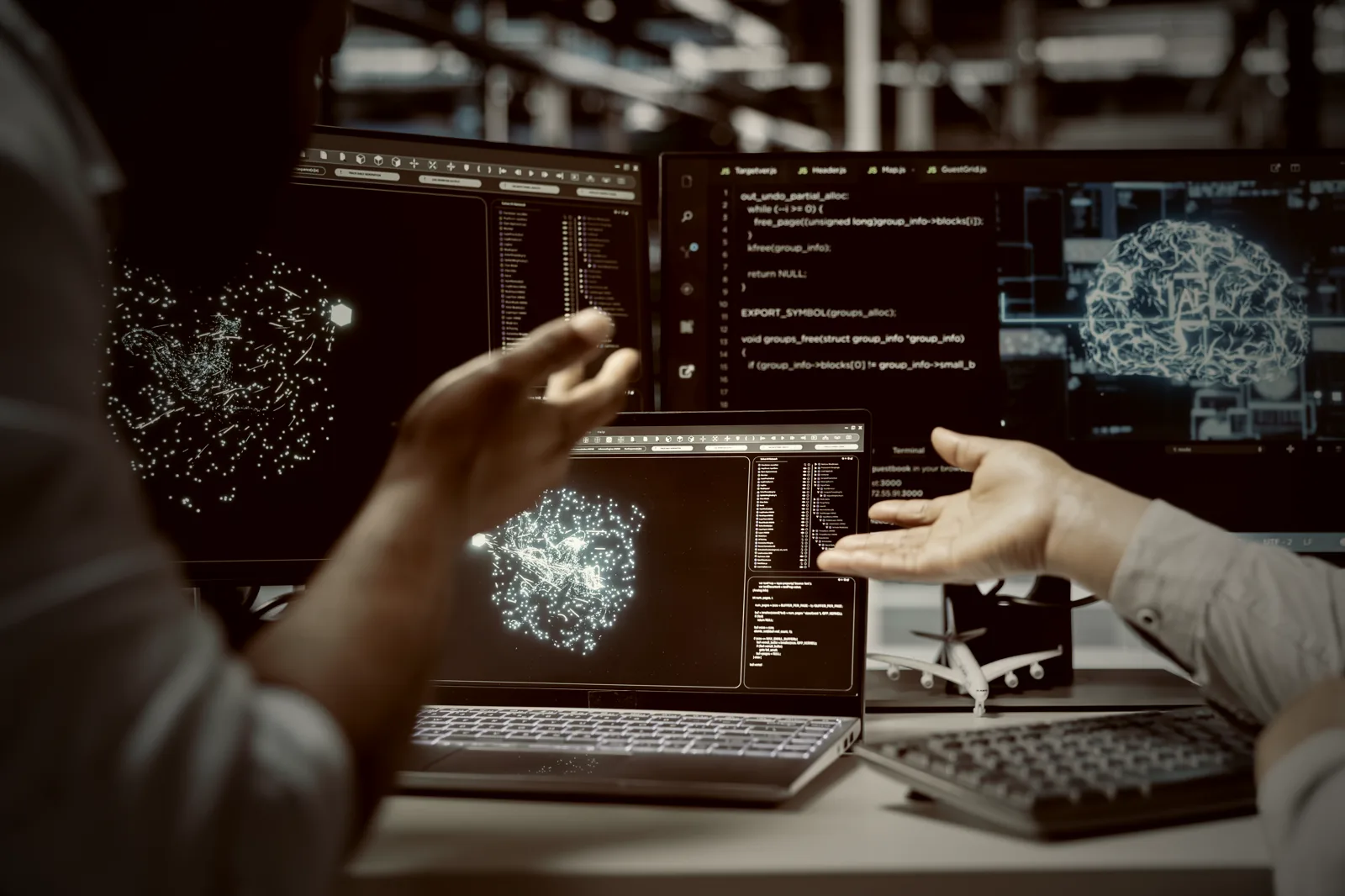 An engineering team reviewing AI system output together, the independent testing that every AI framework now expects.