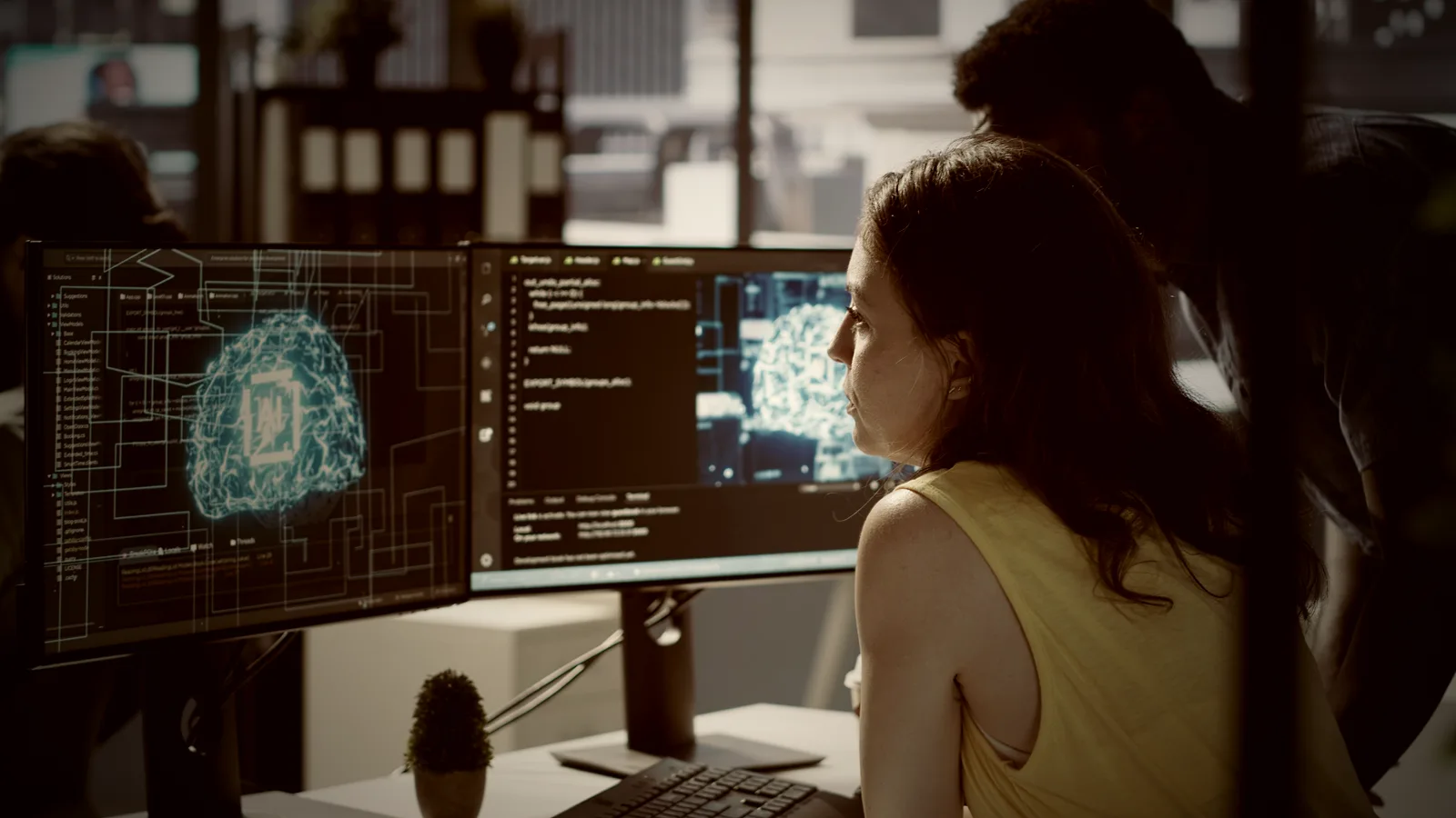 An engineer at a workstation reviewing machine-learning output, the point where an AI system meets the people who can test it.