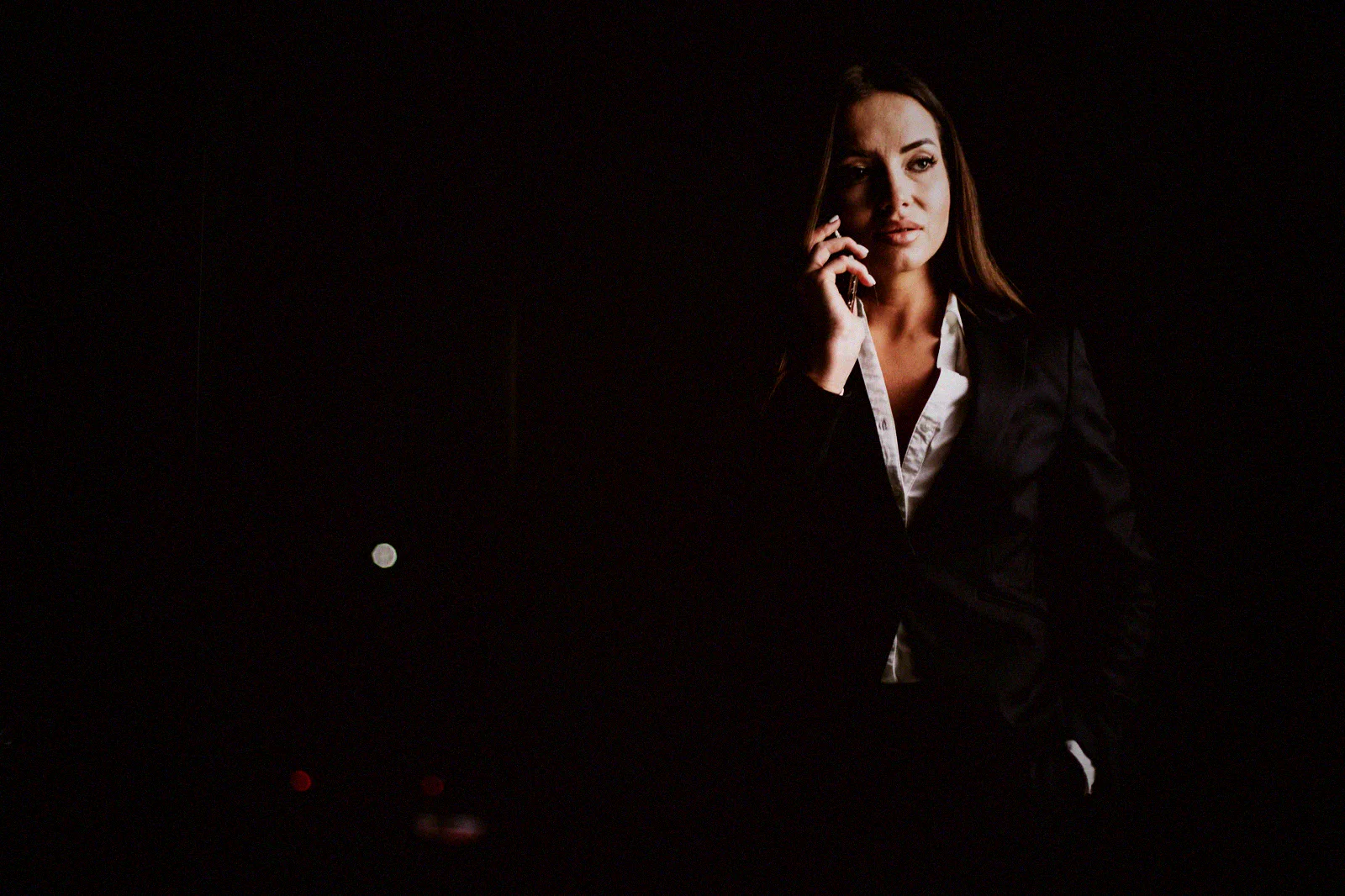 A Manila business owner on the phone late at night, working through the fallout of a breach.